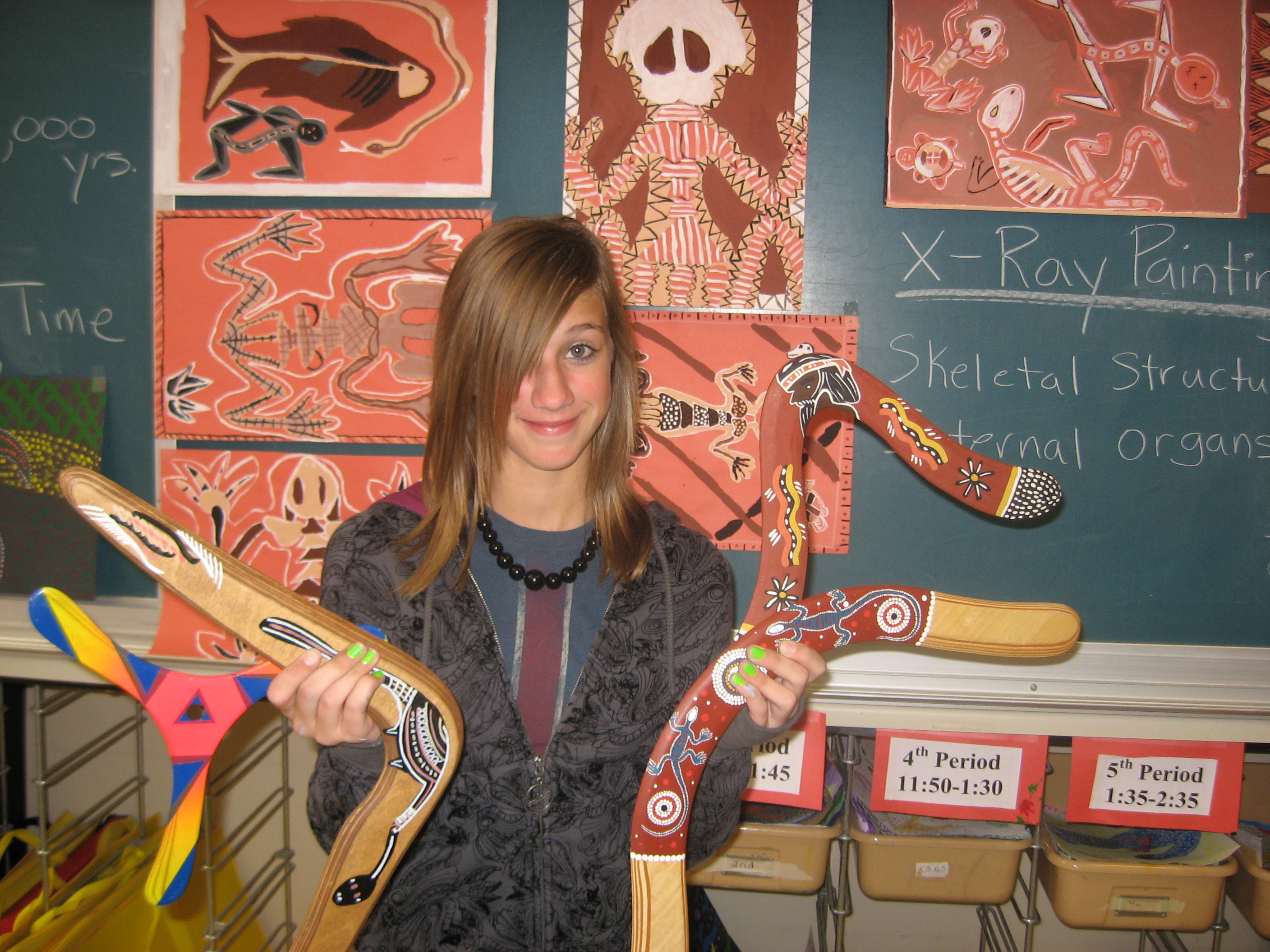 Holly with Aboriginal art boomerangs in Art class
